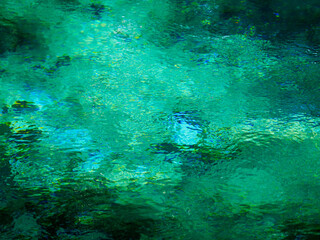 Water springing from the emerald green ground