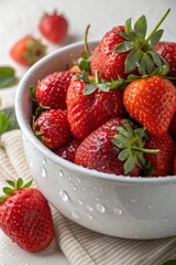 A bowl full of freshly washed strawberry