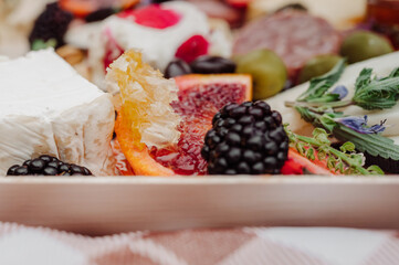 Close-up of brie, honeycomb and blood orange charcuterie board.