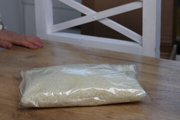 Wax granules in a bag. Wax for crafts and creativity. It is lying on the table.