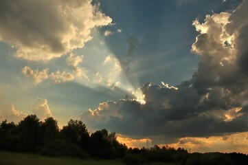 Golden Rays Piercing Through Dramatic Cloudscape
