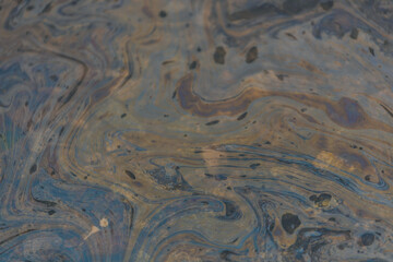 Gasoline or oil stain spill water pollution. Industrial oil fuel stain spill water pollution. Ecological disaster. Oil film pollution. Water pollution with oil, gasoline
