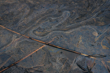 Gasoline or oil stain spill water pollution. Industrial oil fuel stain spill water pollution. Ecological disaster. Oil film pollution. Water pollution with oil, gasoline