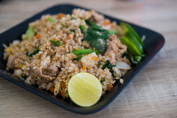 Thai dish of Khao pad moo fried rice. Fried rice with pork