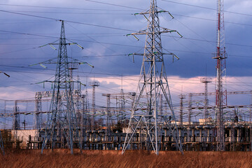 Industrial Power Lines and Electrical Infrastructure Against Dramatic Sky