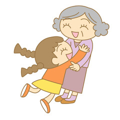 笑顔で抱き合うおばあちゃんと女の子