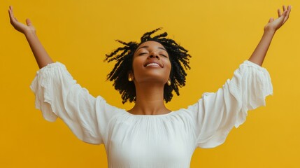 Young woman letting go of problems , and feeling free with arms in the air. Praise and worship concept.