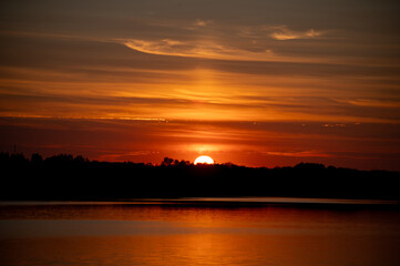 Fototapeta premium beautifil red sunset over the lake