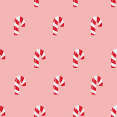 Fototapeta premium Cute vector Christmas pattern with candy canes. Seamless texture with holiday sweets on pink background. Template for wrapping paper 