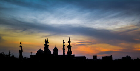 Dramatic silhouette of a mosque at sunset