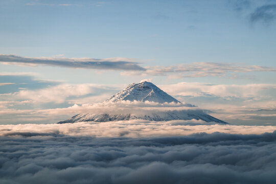 Cotopaxi between layers of clouds