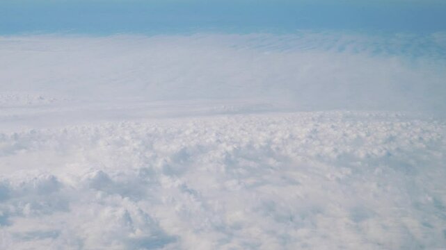Flight above the clouds in 4K