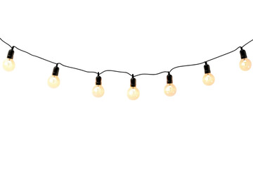 Decorative string lights illuminate a cozy outdoor space during a summer evening gathering