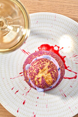 A delicate and elegant French choux pastry, or profiterole, filled with a light and airy lavender cream and topped with edible lavender flowers.