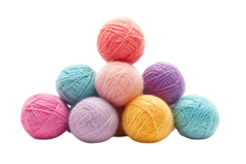 Colorful yarn balls stacked in a creative arrangement at a crafting workspace