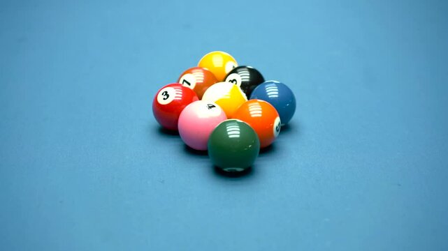 A set of billiard balls is placed on the billiard table, viewed from the side.