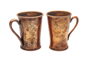 Unique vintage copper mugs showcasing artisanal craftsmanship in a classic design for beverages