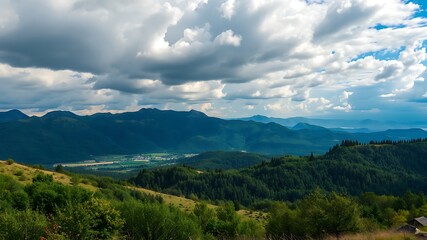 Panoramic view of lush green mountains and a serene valley under a cloudy sky, featuring a small village nestled among the hills.