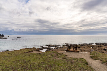 An old rusty bench in Treyarnon Bay, Cornwall, England, UK