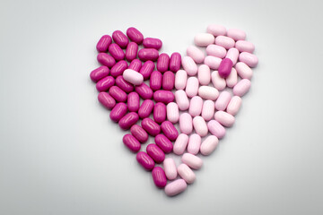 Heart sign made of colorful pills.
