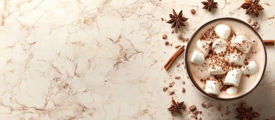 Hot chocolate with marshmallows and spices on a marble background with Copy Space for text.