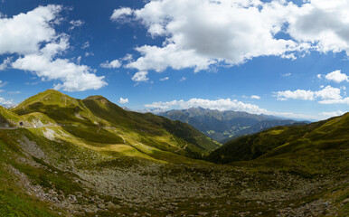 Fototapeta premium Colorful green mountain valley shot in summer under a deep blue sky