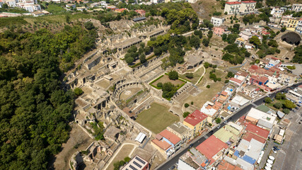 Fototapeta premium Aerial view of the archaeological park of Baia, a hamlet of Bacoli, near Naples, in Campania, Italy. It was an ancient Roman town situated on the Cumaean Peninsula in the Phlegraean Fields.