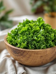 Fototapeta premium Fresh green leafy kale in rustic wooden bowl on kitchen counter
