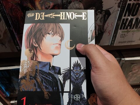 South Kalimantan, Indonesia - 09 04 2024 : Japanese comic, manga with the title Death Note which is being held in hand