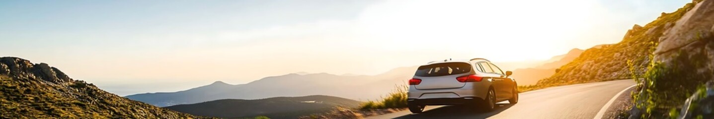 Fototapeta premium Rental car driving on a winding road in Spain with stunning mountain landscape at sunset, highlighting the breathtaking details and vibrant colors of the scenery.