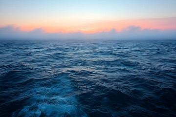 Obraz premium Ocean sunrise, misty horizon, calm waves, travel postcard