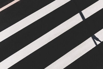 Zebra crossing shades in urban sunlight