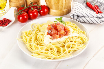 Pasta spaghetti with salmon and stracciatella