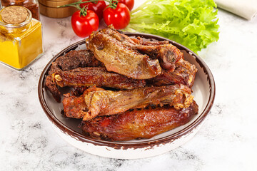 Roasted duck wings with sauce