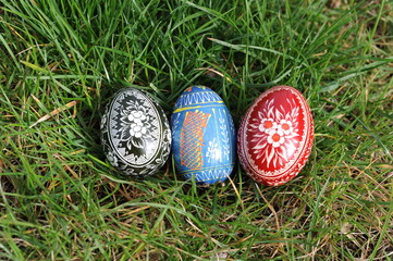 Traditional hand dyed and hand painted colorful Easter eggs on the green grass in Poland called pisanka or kroszonka or kraszonka, Poland, Europe