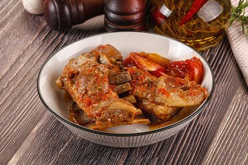 Baked lamb ribs with vegetables