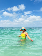 Tourist enjoying crystal clear water in tropical los roques archipelago, venezuela