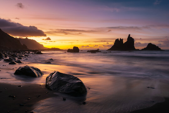 Amazing sunset with dramatic sky at ocean beach