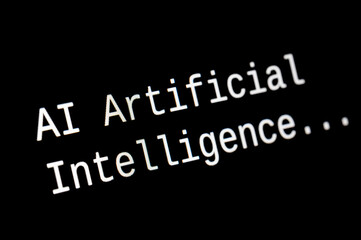 Black computer screen, with the text AI Artificial Intelligence. Use and evolution of artificial intelligence.