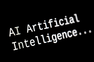 Black computer screen, with the text AI Artificial Intelligence. Use and evolution of artificial...