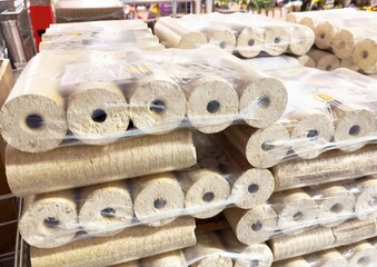 Stacks of packed wood logs for fireplaces in a store display
