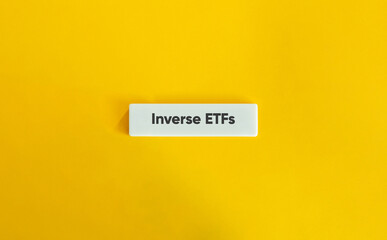 Inverse ETFs. Text on Block Letter Tile on Yellow Background. Minimal Aesthetic.