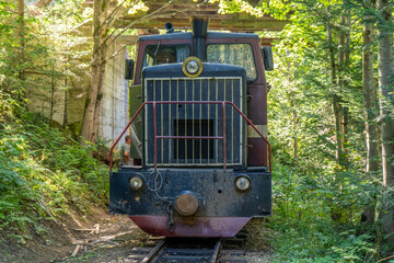 Carpathian tram cabin. Steam locomotive on a narrow-gauge railway. Old transport in the forest nature