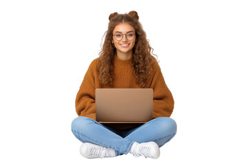 Young woman with curly hair sitting cross legged using a laptop, isolated on transparent background