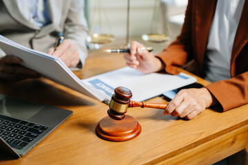 business people and lawyers discussing contract papers sitting at the table. Concepts