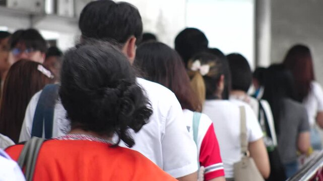 BANGKOK, THAILAND - AUGUST 2024 : View of crowd of people at the street. Locals and tourists in downtown area. Thai people, tourism and city life concept video.