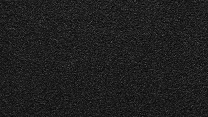 A black background with no visible objects. The background is dark and has a rough texture. The image has a moody and mysterious feel to it