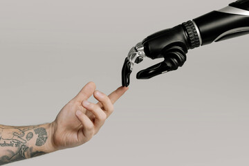  man and bionic arm a robot hand touching a mans hand