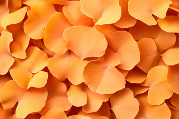 A close-up shot showcasing a vibrant collection of orange flower petals, creating a captivating texture and color pattern.