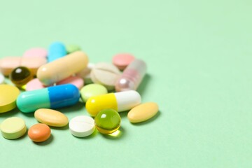 Various pills on color background